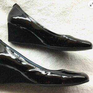 Rockport wedge heels with black patent leather uppers and black suede heels.  Si